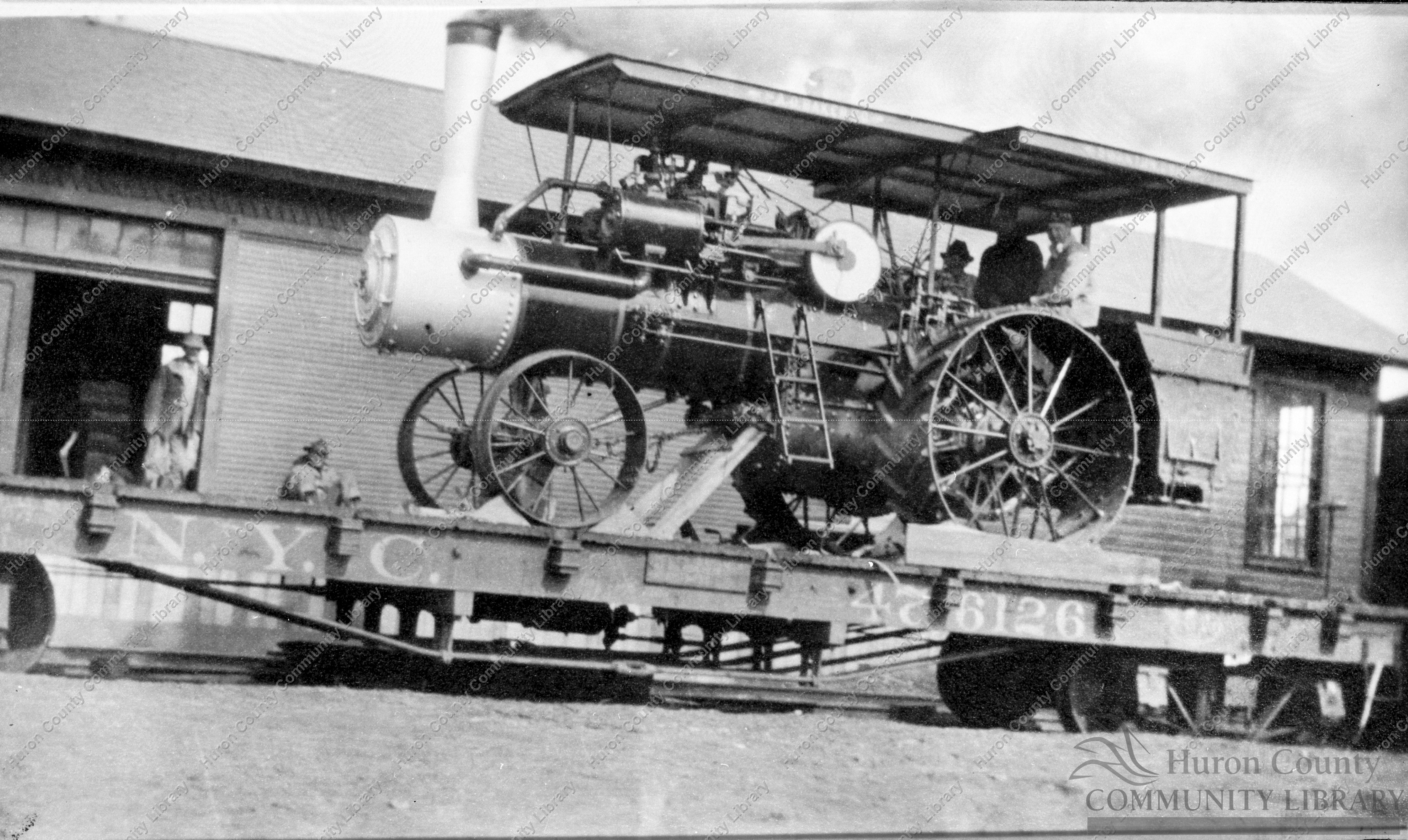 Flat car load Threshing Engines & Seperators on W. & L.E. R.R.