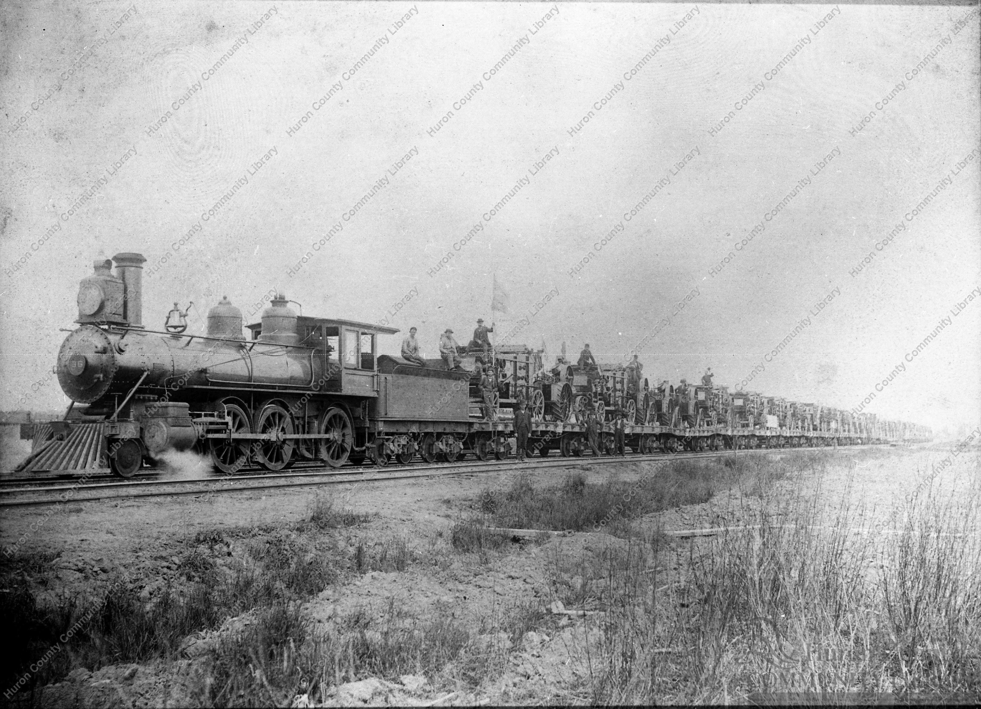 Train loaded with Threshing Engines & Seperators on W. & L.E. R.R.