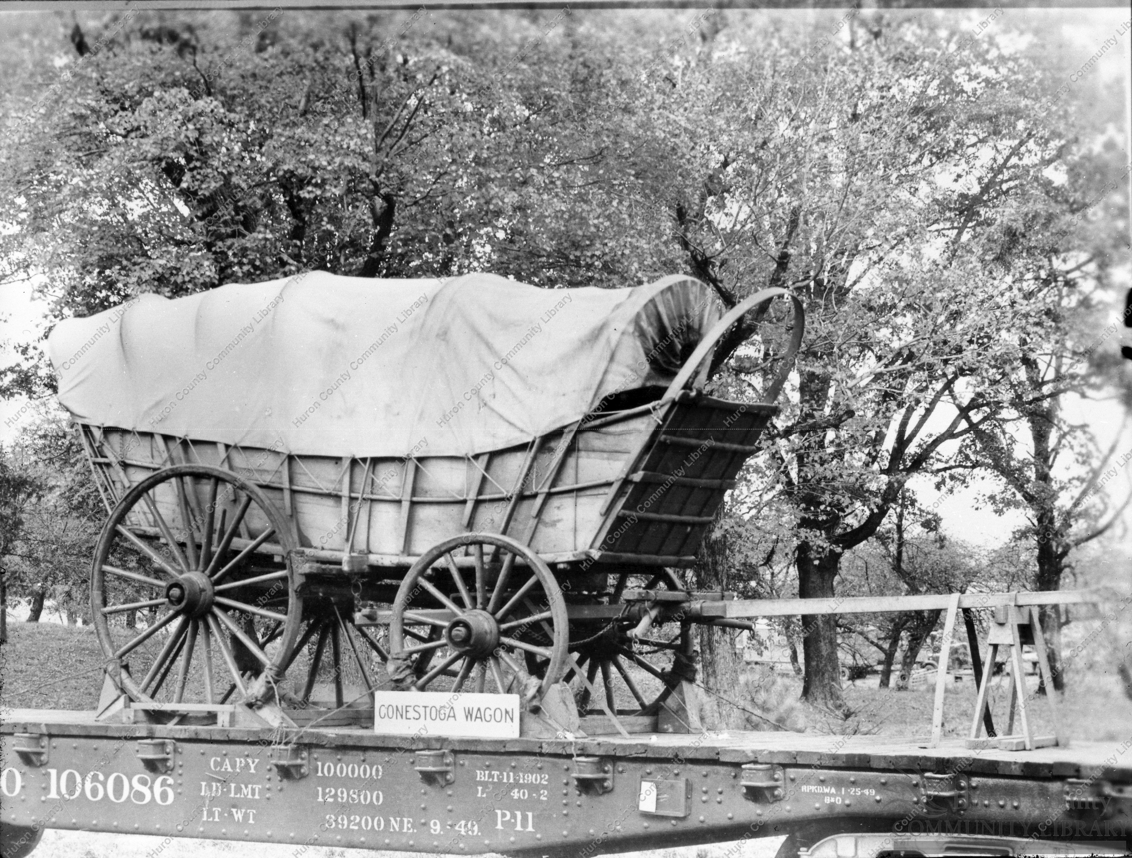 Conestoga Wagon (Prairie Schooner) loaded on flat car