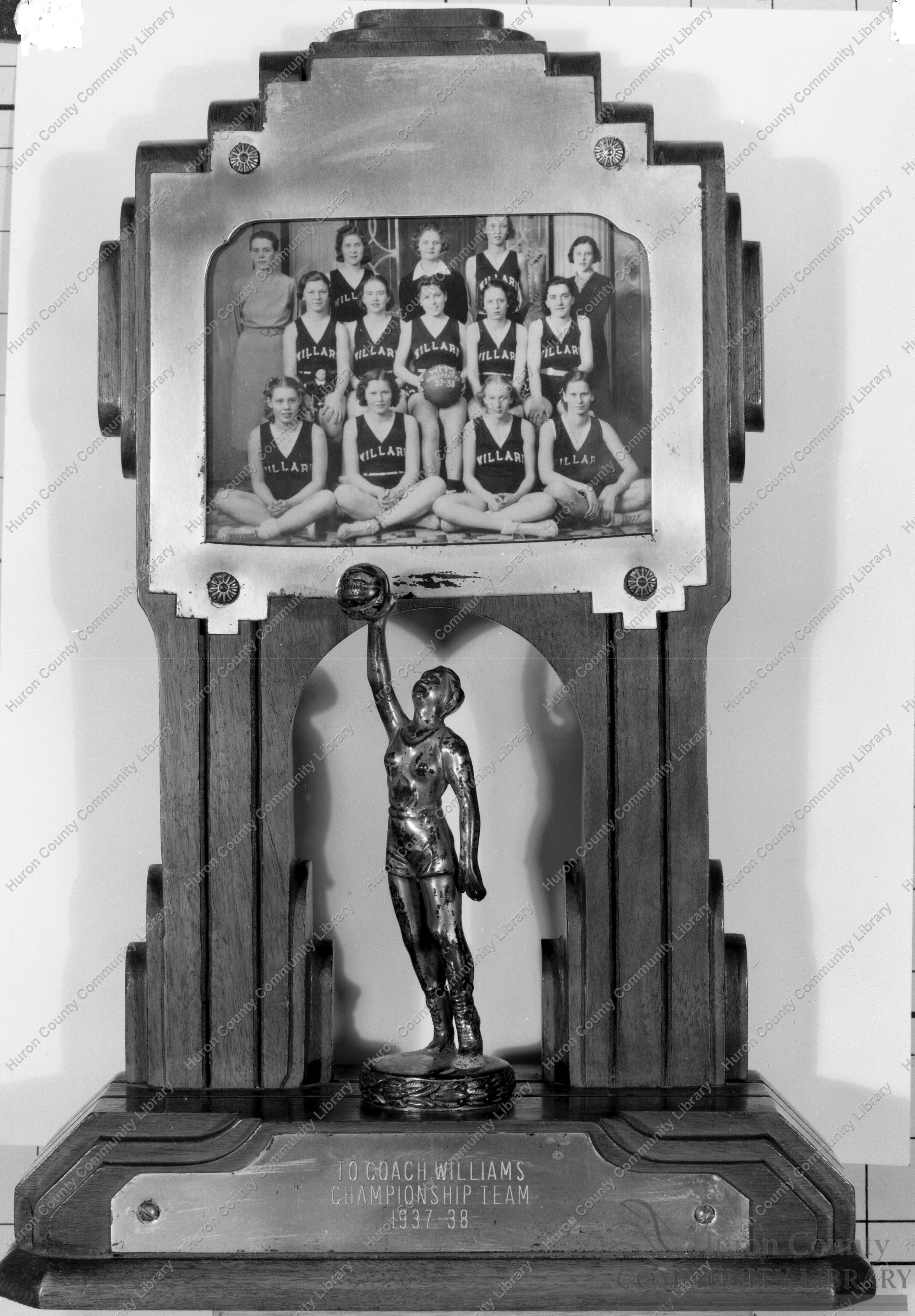 Trophy given to Coach Williams & Champion Basketball Team 1937-38