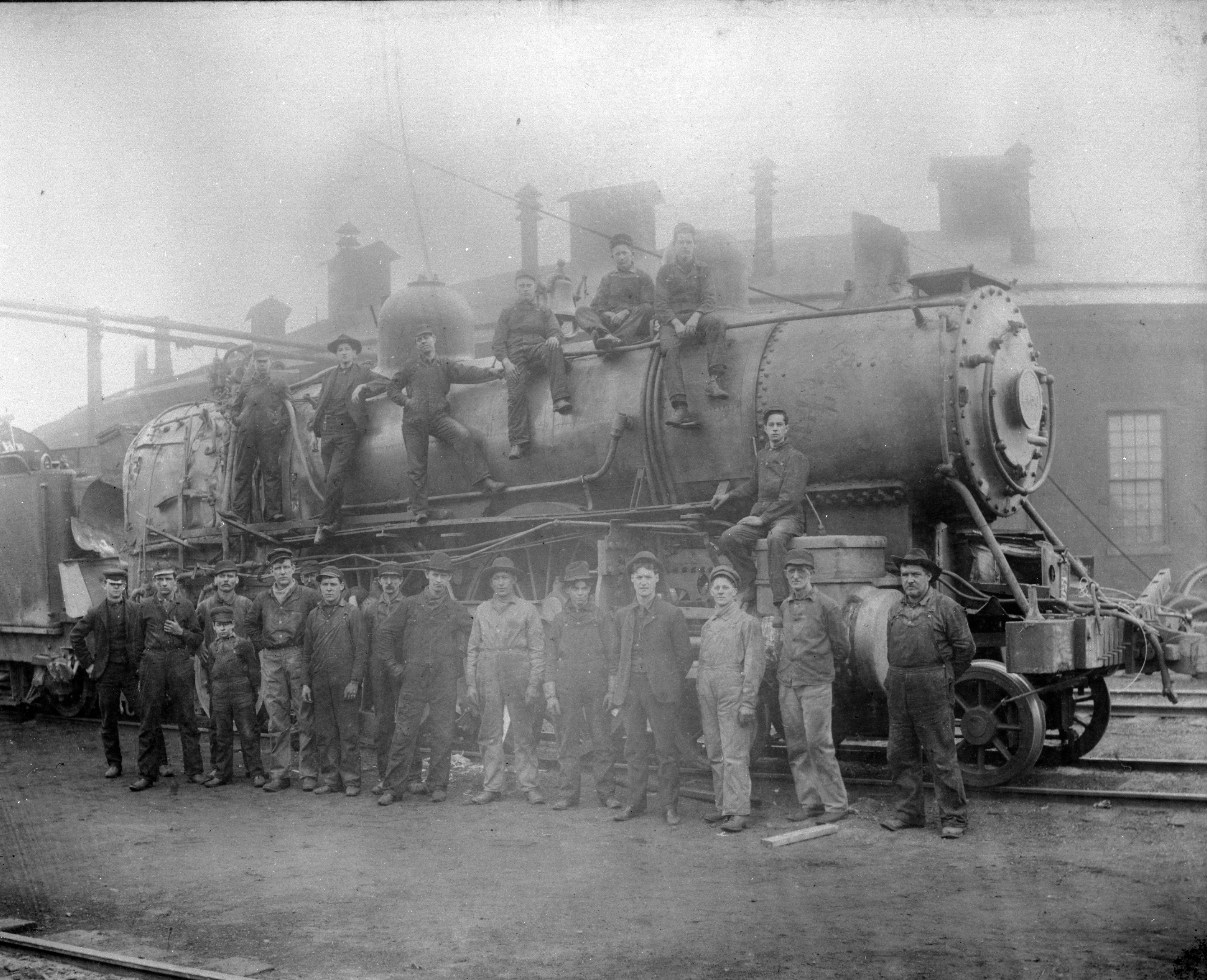 B & O Shop Crew showing type of repairs they undertook in 1898, Roundhouse in background.