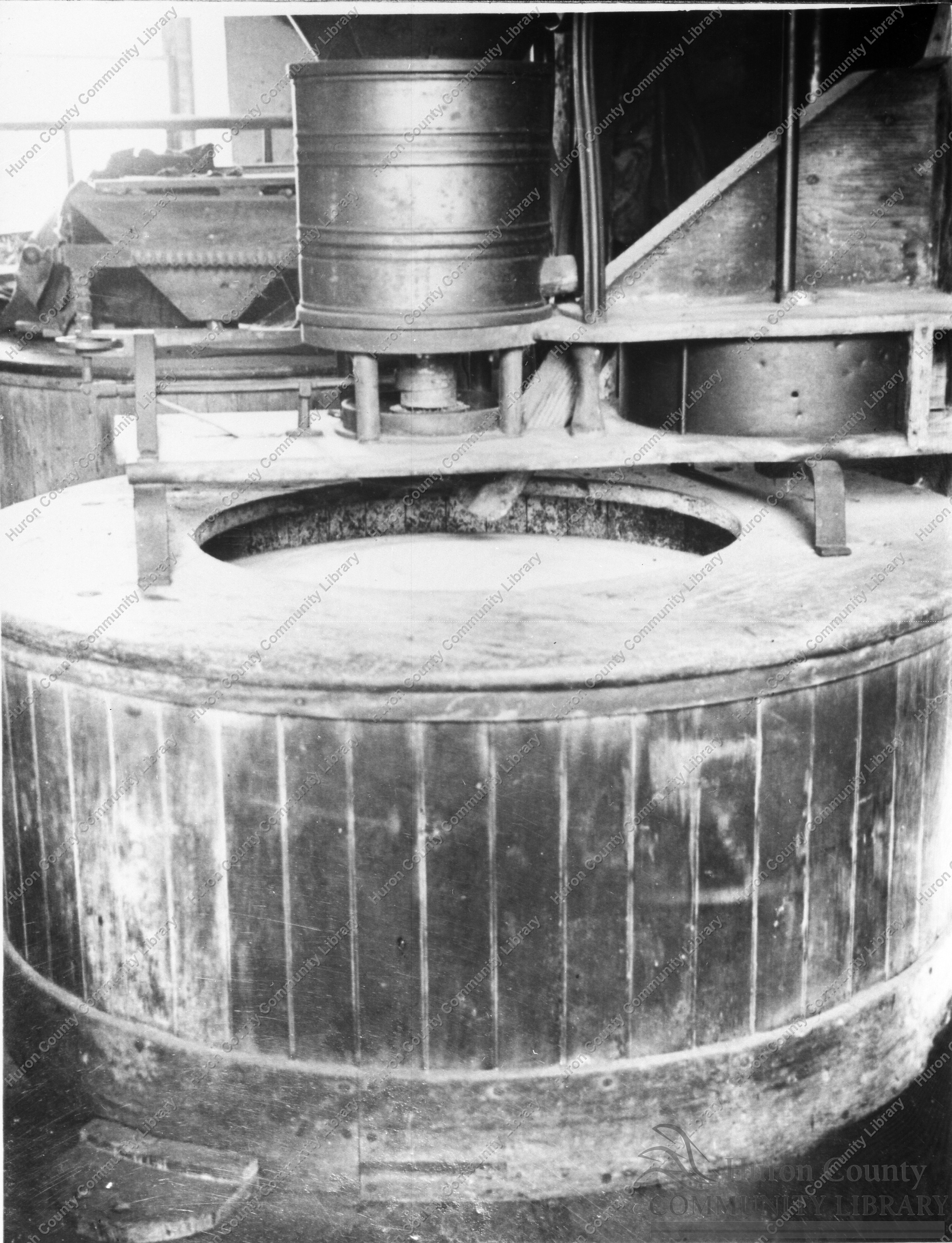 Old Stone Grinder in Mill 1930 by Gilbert Burras