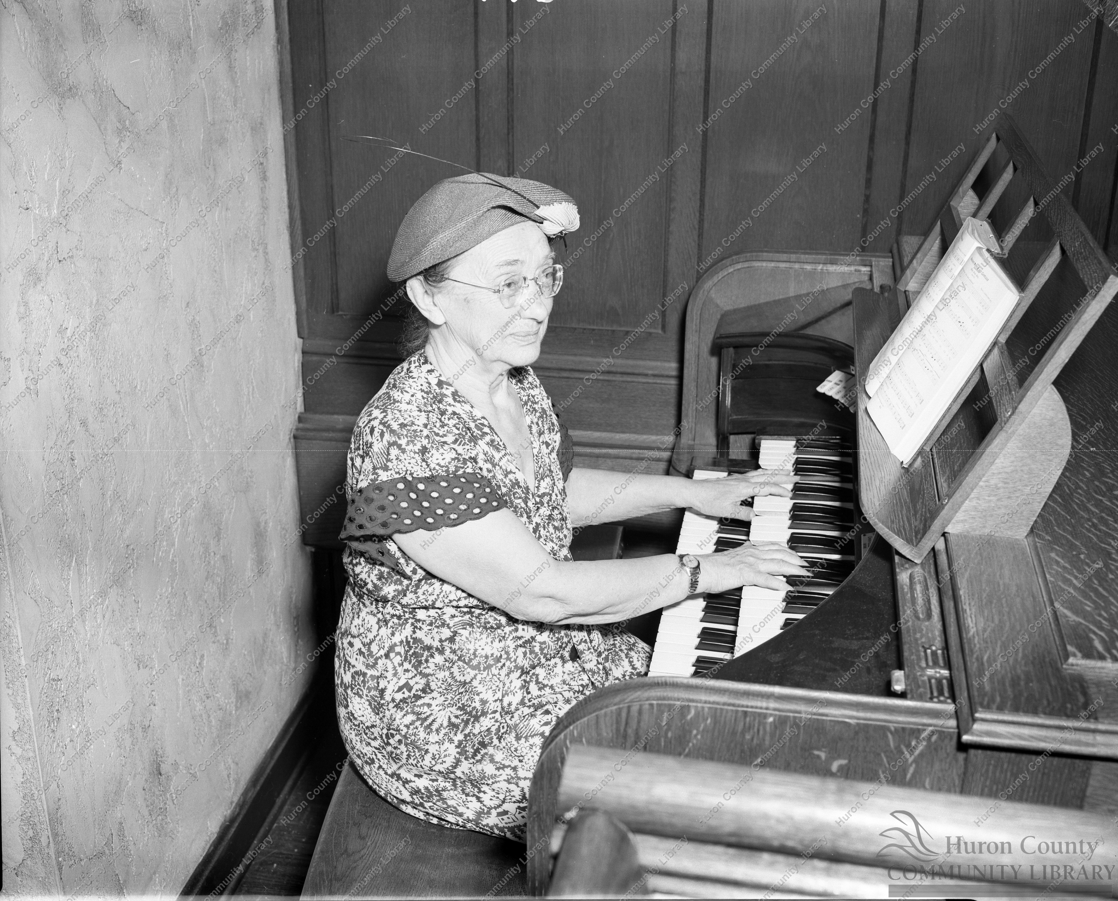 Lettie LaBounty at organ-Presbyterian Church-School Teacher E. Side
