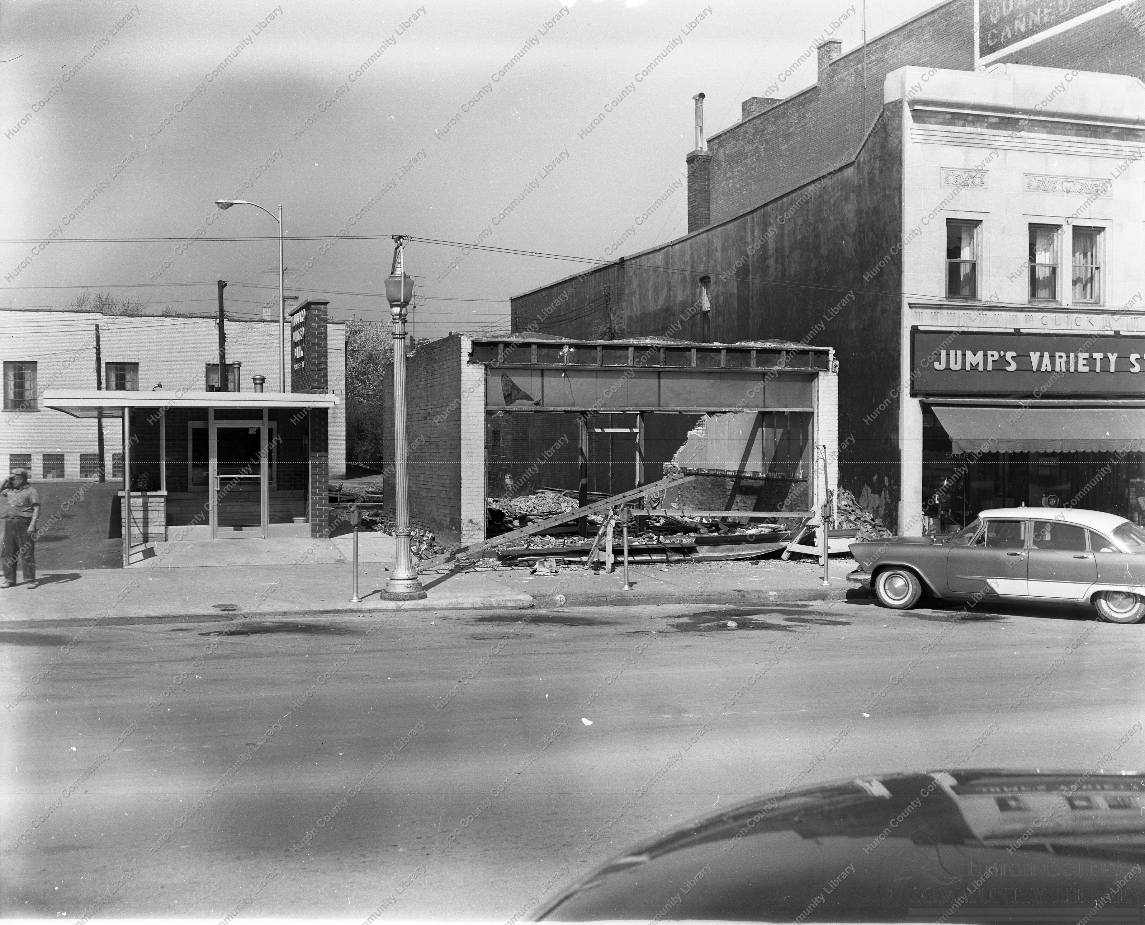Razing old store, in unit block of Myrtle in 1959 to build new