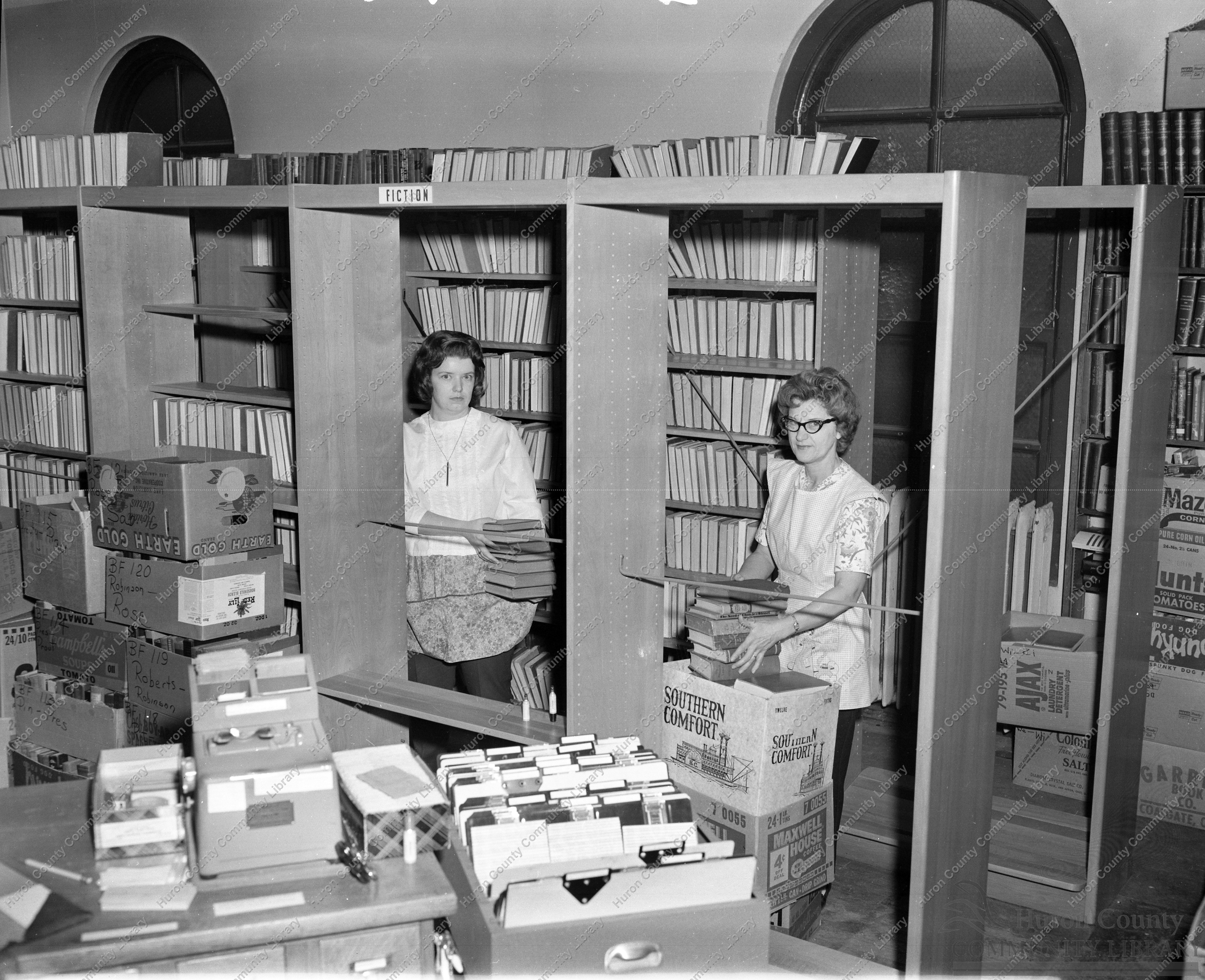 Packing books in old Library, preparatory to moving 3 blocks