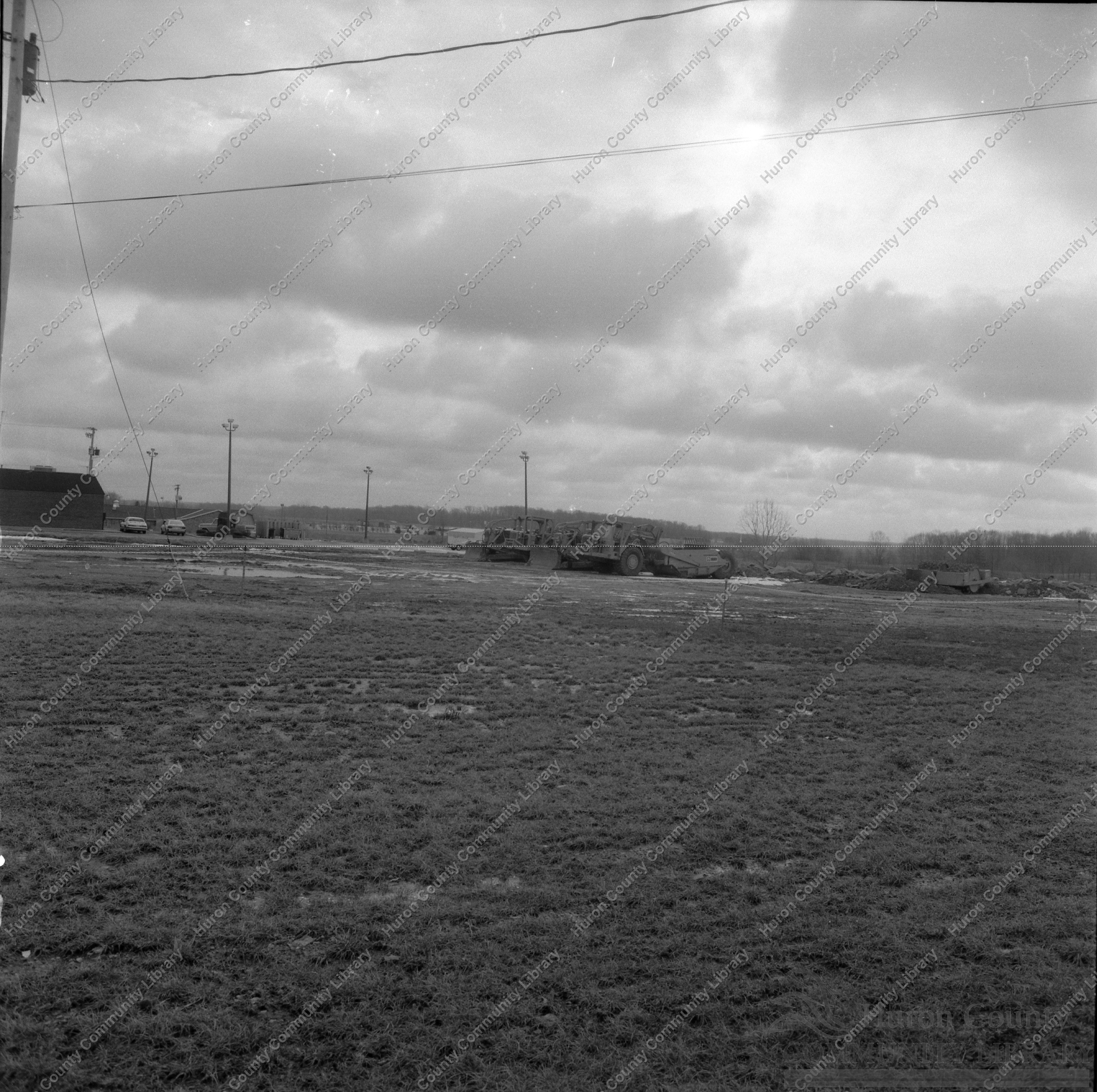 South East from back of Inmon's Car lot showing road machinery