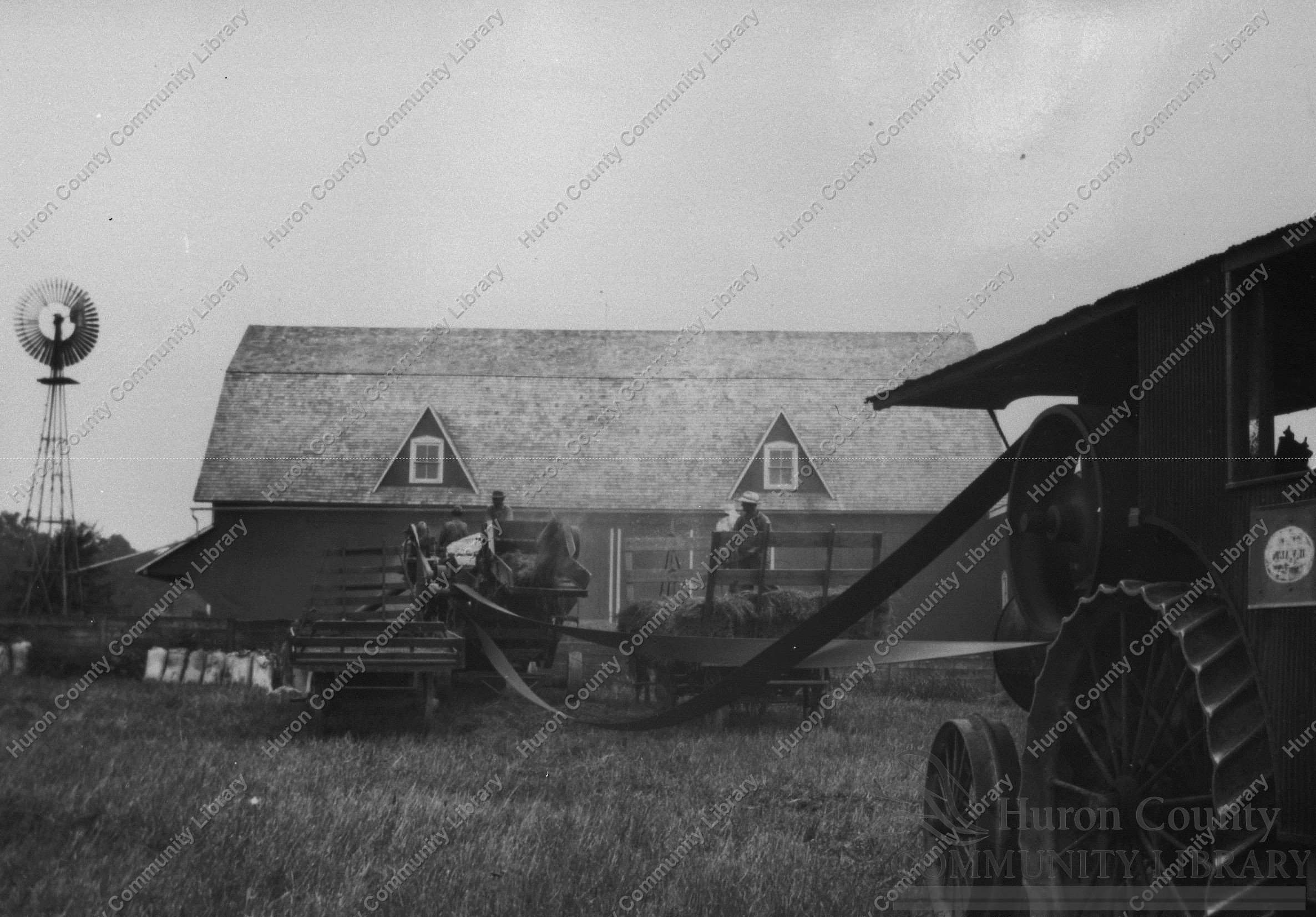 Threshing with Steam Eng. & Long belt to avoid fire from dust